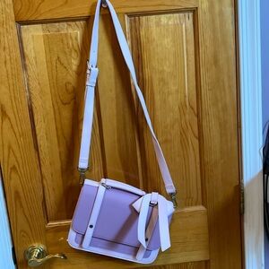 Purple feminine shoulder or handle bag.
